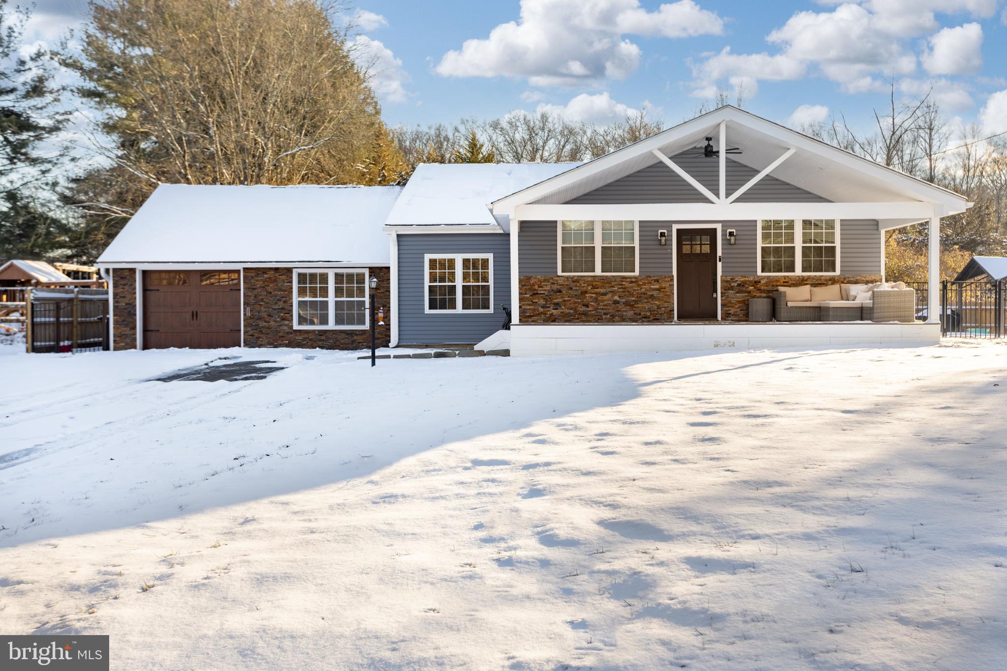 282 Juliustown Road Columbus, NJ 08022 - Photo 1 of 37 a front view of a house with a yard covered in snow