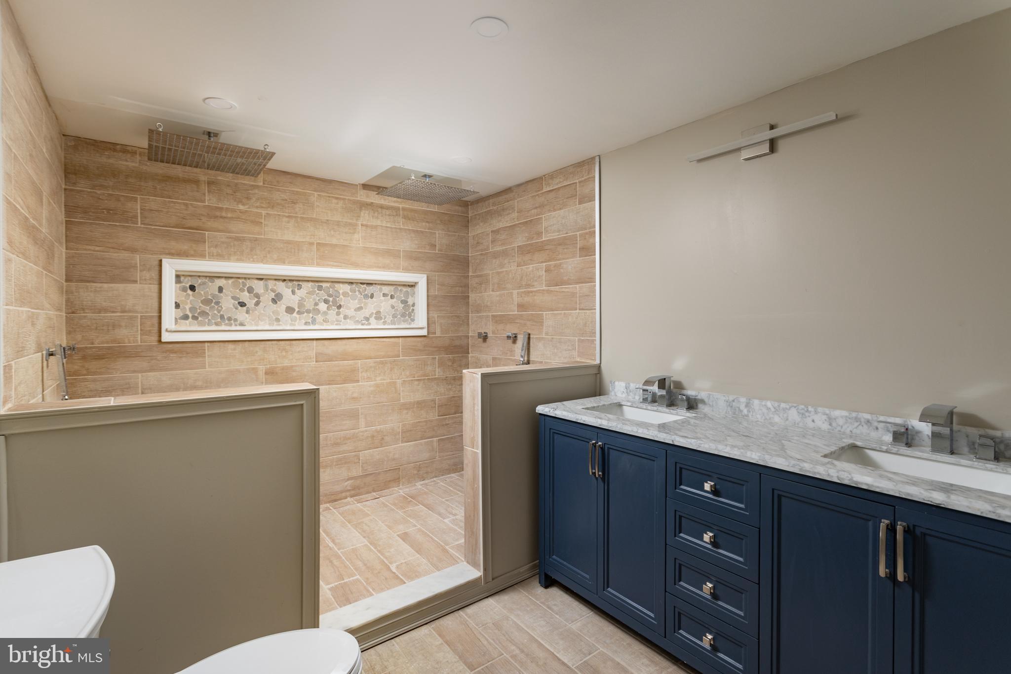 282 Juliustown Road Columbus, NJ 08022 - Photo 23 of 37 a bathroom with a granite countertop sink a mirror and a toilet