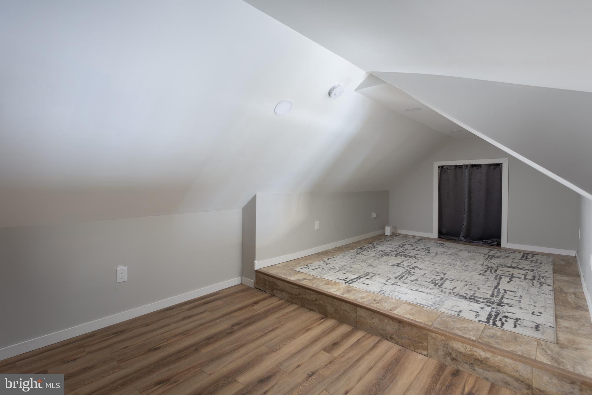 282 Juliustown Road Columbus, NJ 08022 - Photo 31 of 37 a view of a room with wooden floor and bench
