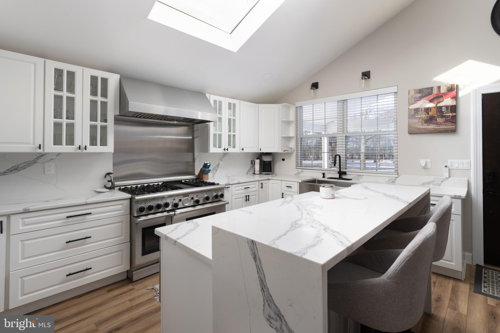 282 Juliustown Road Columbus, NJ 08022 - Photo 8 of 37 a kitchen with a stove a sink and a refrigerator