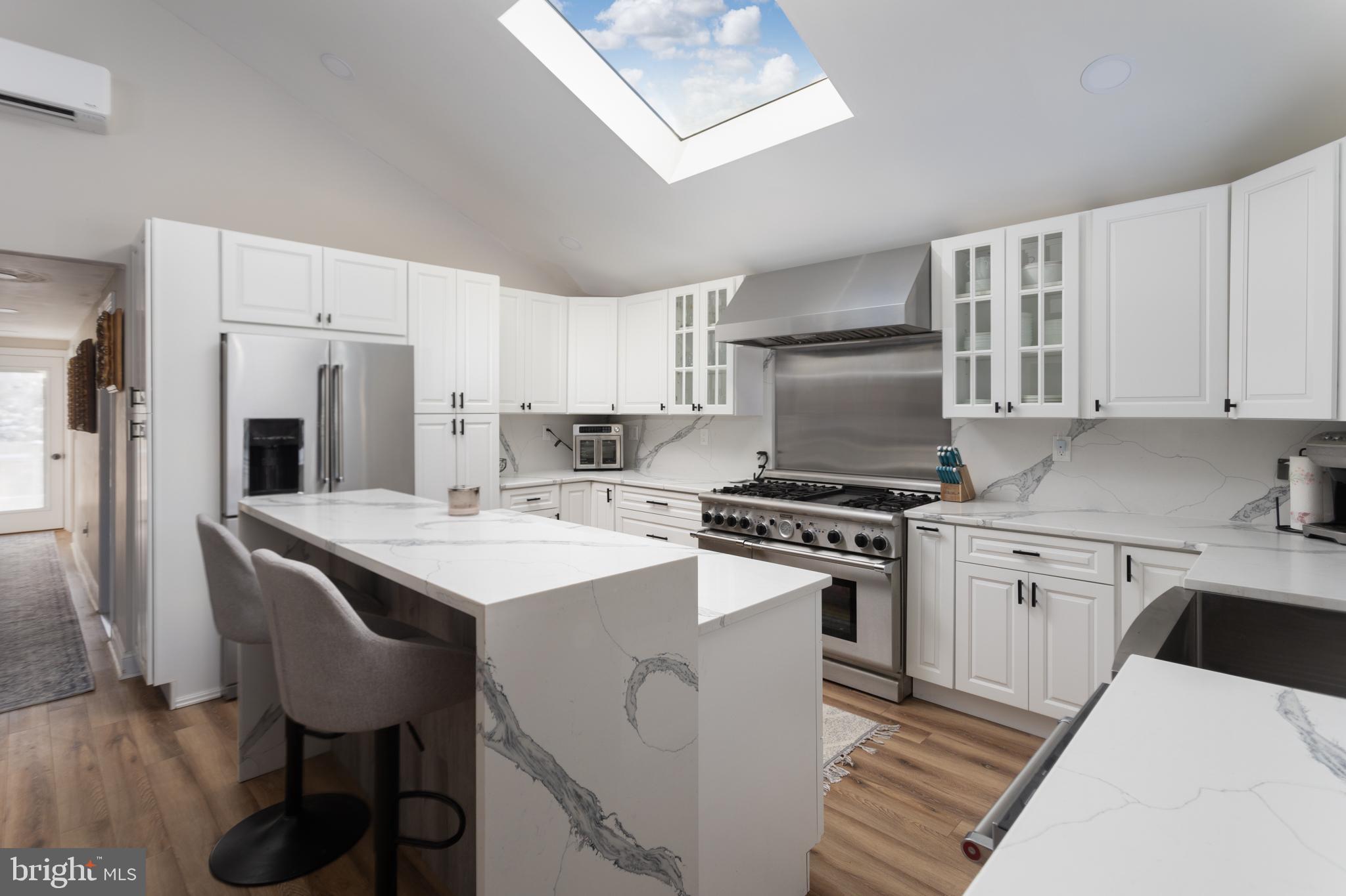 282 Juliustown Road Columbus, NJ 08022 - Photo 9 of 37 a kitchen with a stove a sink and a refrigerator