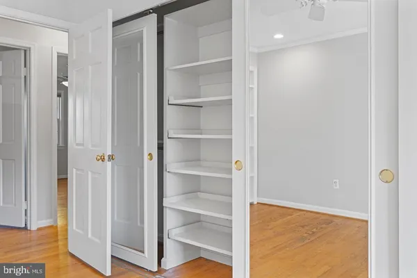 a view of a room with wooden floor and closet