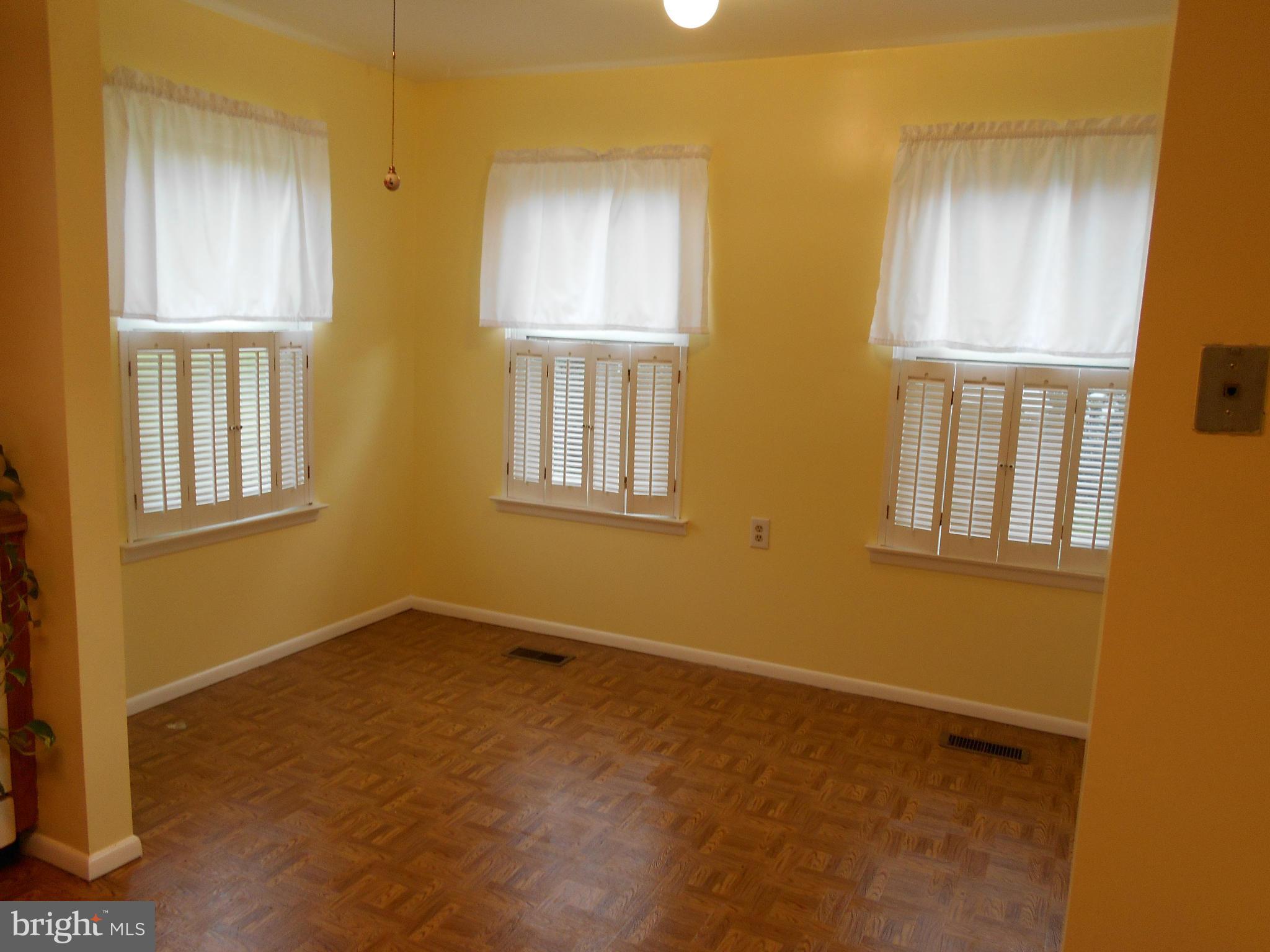 7048 Catalpa Road Frederick, MD 21703 - Photo 12 of 26 a view of an empty room with windows