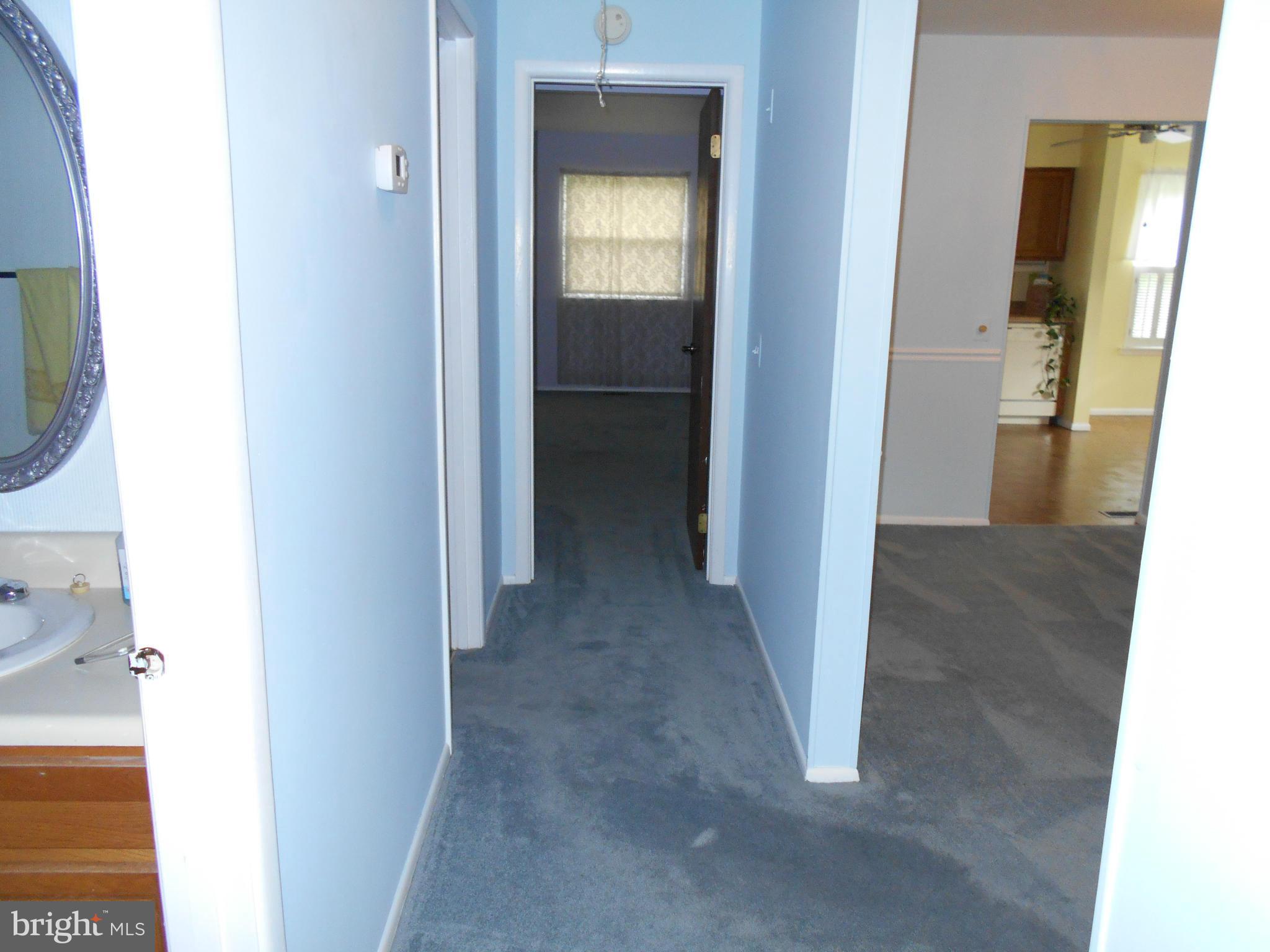 7048 Catalpa Road Frederick, MD 21703 - Photo 16 of 26 a view of a hallway with a room