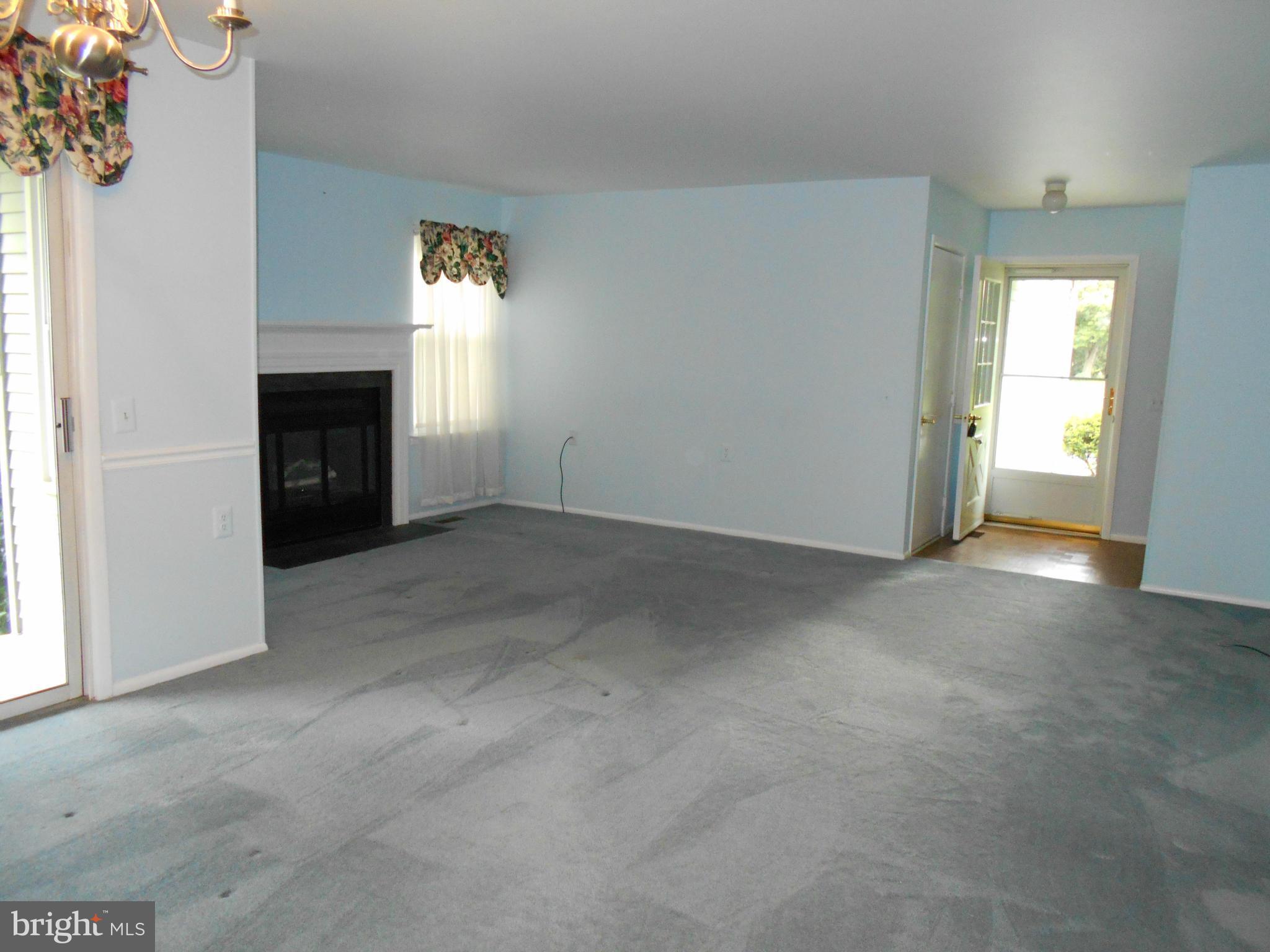 7048 Catalpa Road Frederick, MD 21703 - Photo 8 of 26 a view of empty room with a fireplace