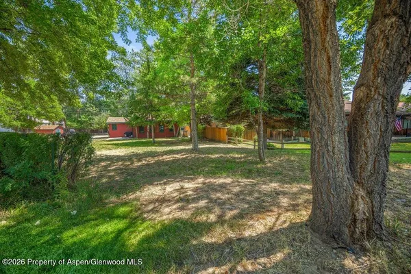 a backyard of a house with lots of green space