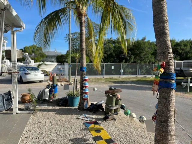 a kitchen with stainless steel appliances granite countertop a refrigerator and a stove