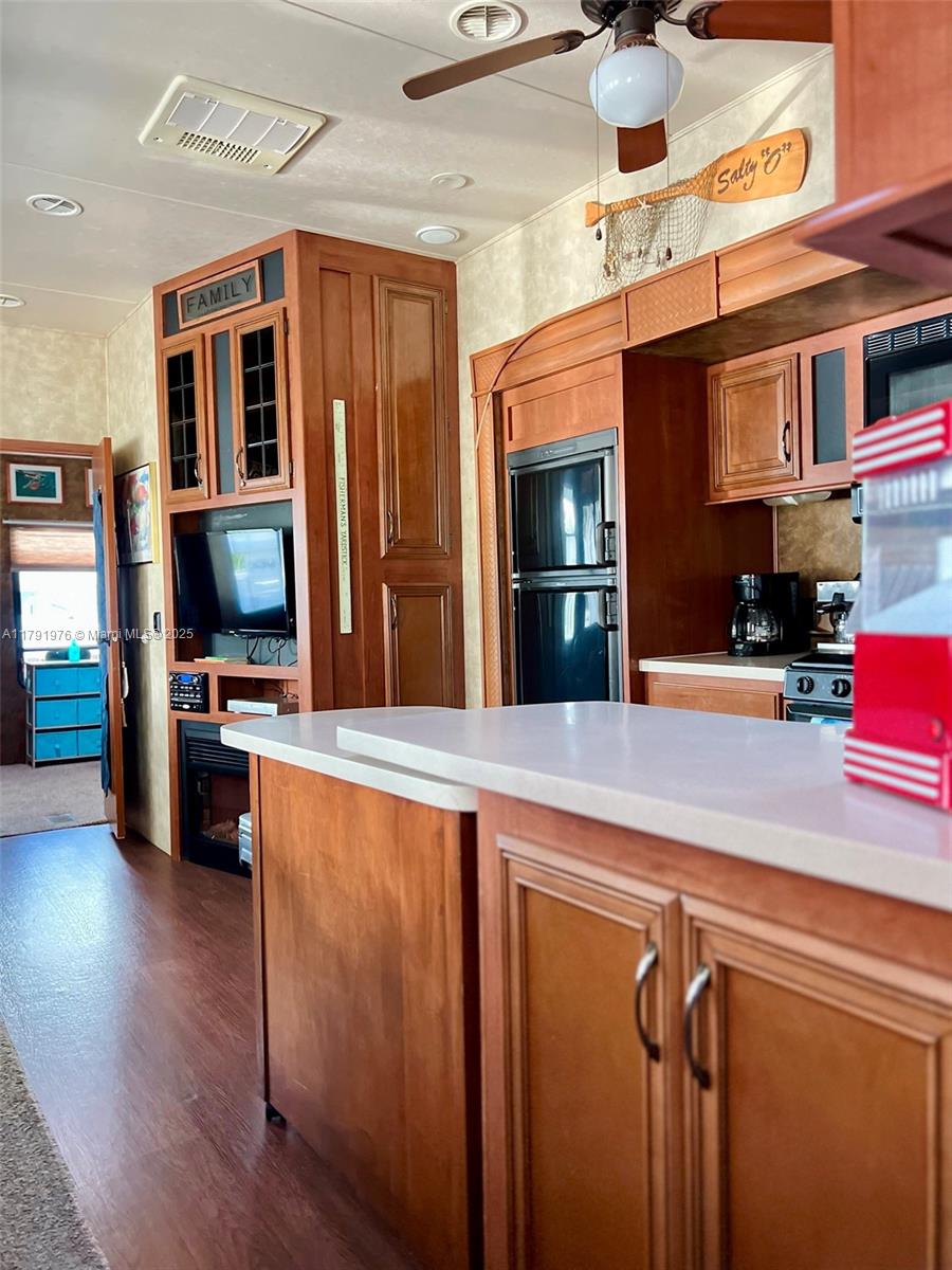 325 Calusa Street Key Largo, FL 33037 - Photo 13 of 48 a kitchen with stainless steel appliances granite countertop a refrigerator and a stove