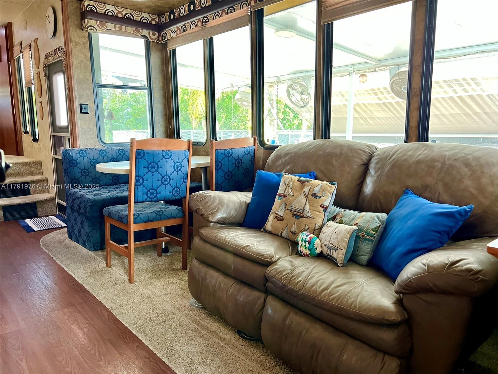 325 Calusa Street Key Largo, FL 33037 - Photo 15 of 48 a living room with furniture and a large window