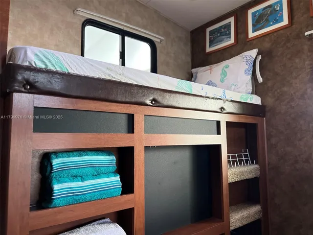 a bathroom with a shower and a sink