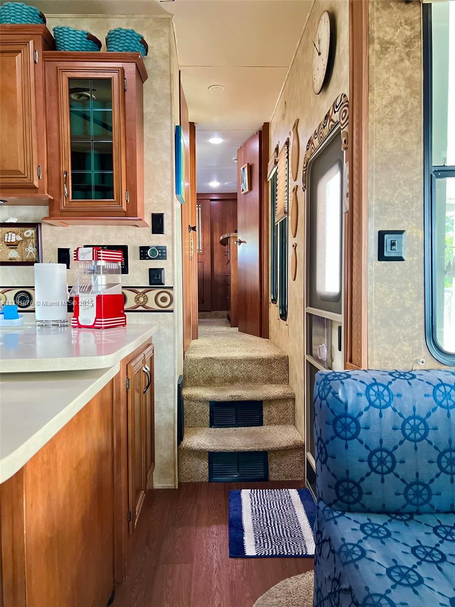 325 Calusa Street Key Largo, FL 33037 - Photo 19 of 48 a living room with stainless steel appliances granite countertop furniture and a kitchen view