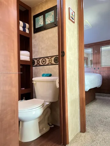 a view of a couch in wooden floor