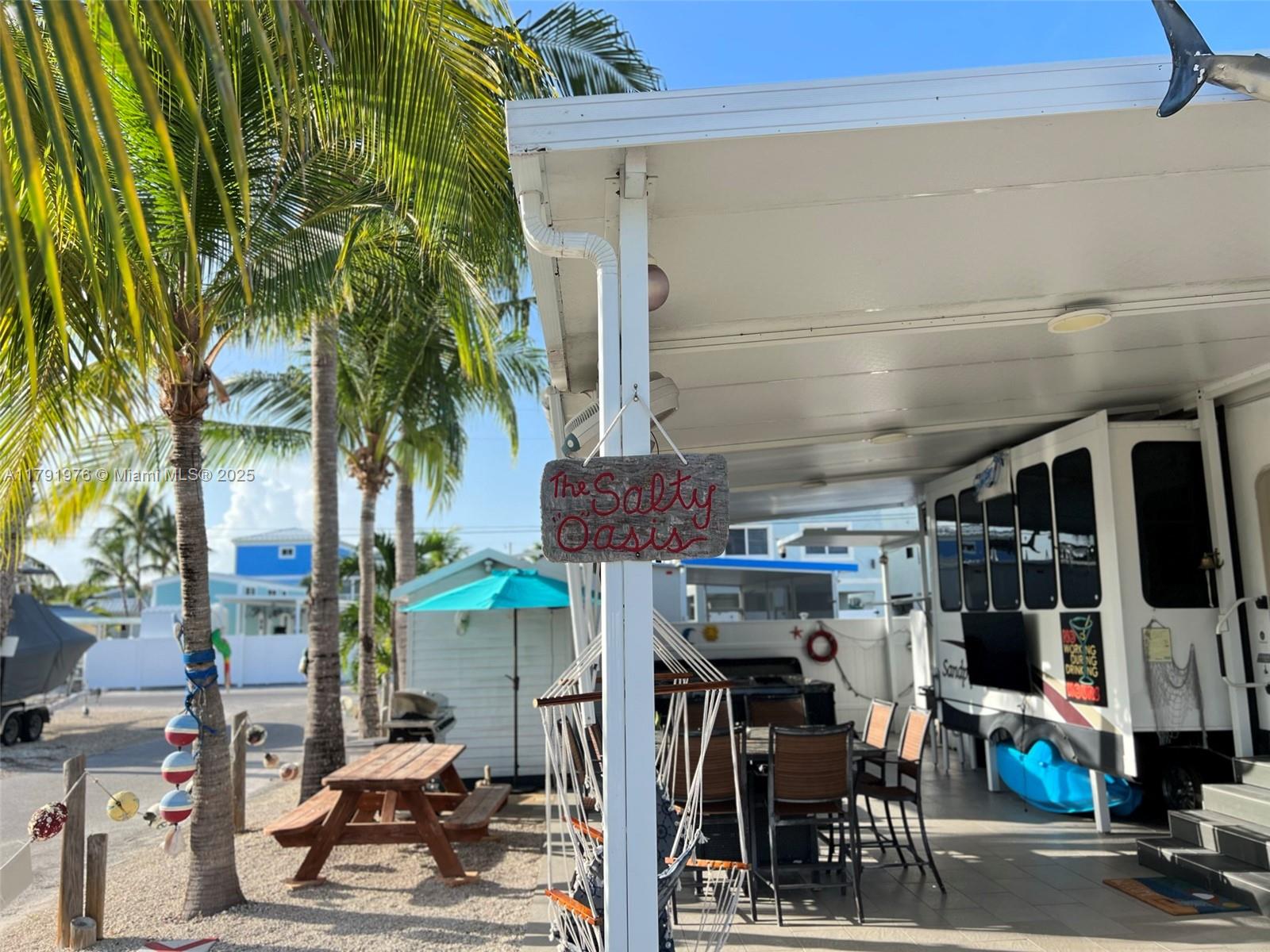 325 Calusa Street Key Largo, FL 33037 - Photo 8 of 48 an outdoor space with seating