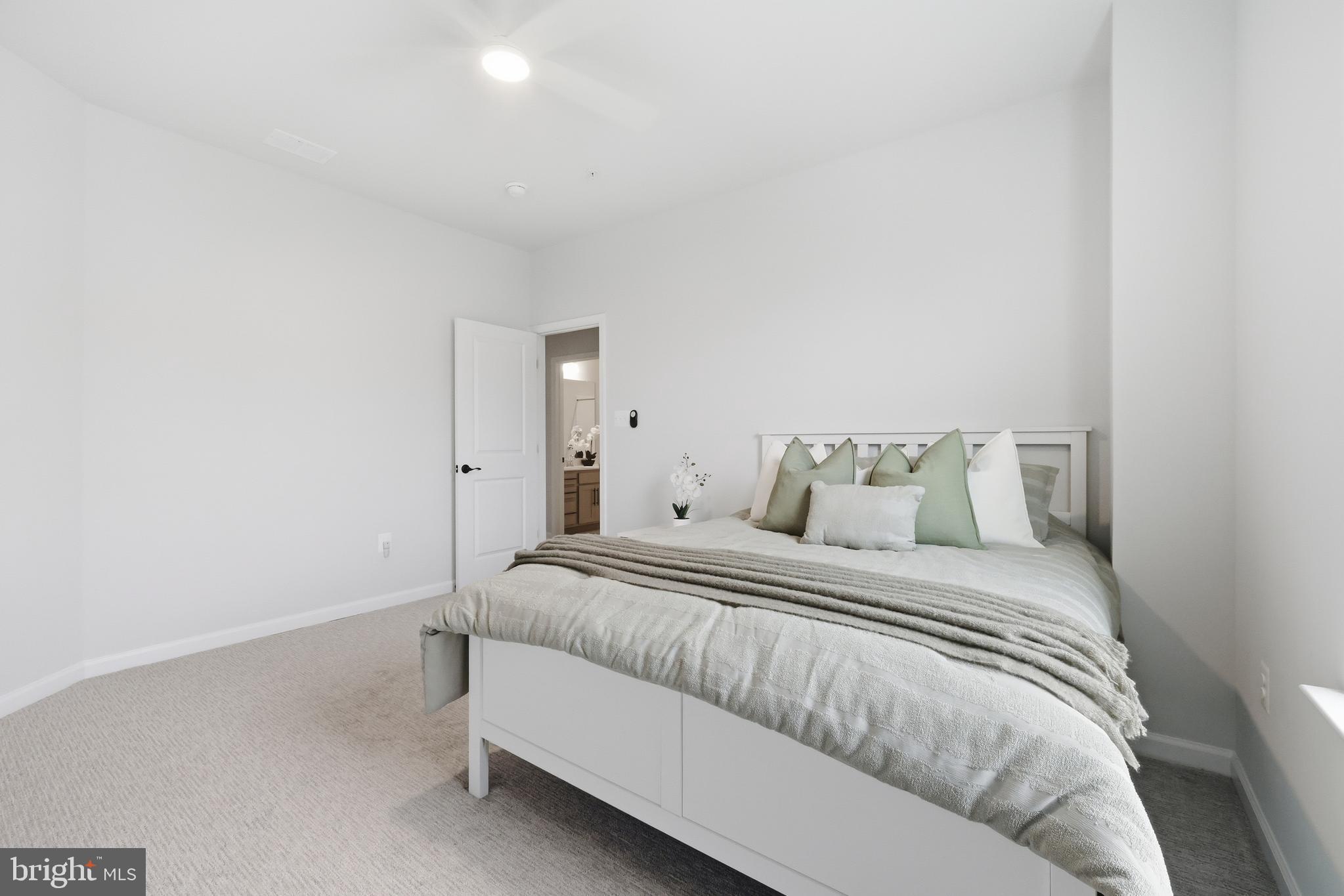 5707 Hawk Ridge Road Frederick, MD 21704 - Photo 54 of 109 a bedroom with a bed and a mirror