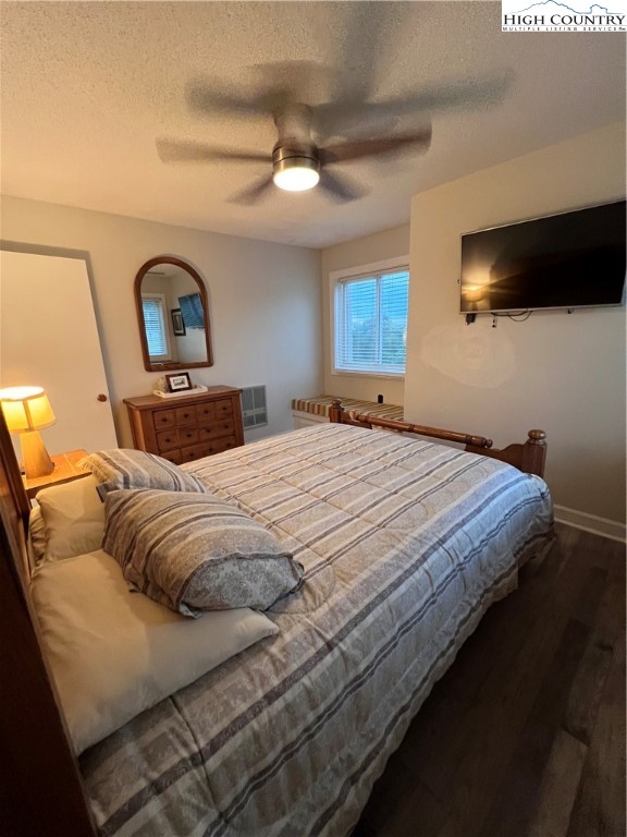 301 Pinnacle Inn Road, Unit 4116 Beech Mountain, NC 28604 - Photo 12 of 16 a bedroom with a bed and a flat screen tv