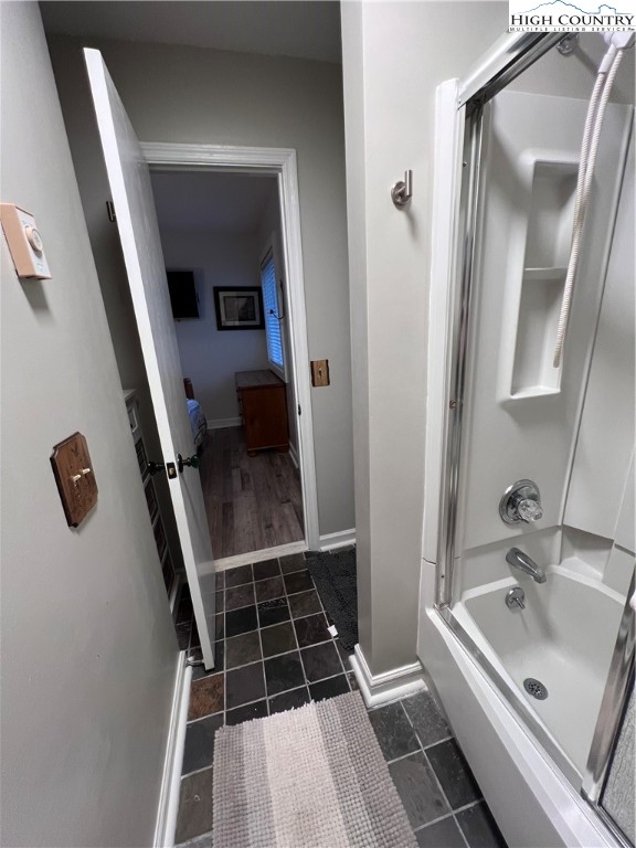 301 Pinnacle Inn Road, Unit 4116 Beech Mountain, NC 28604 - Photo 13 of 16 a bathroom with a sink a toilet a mirror and vanity