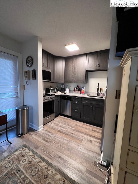 301 Pinnacle Inn Road, Unit 4116 Beech Mountain, NC 28604 - Photo 6 of 16 a kitchen with stainless steel appliances granite countertop a sink refrigerator and cabinets