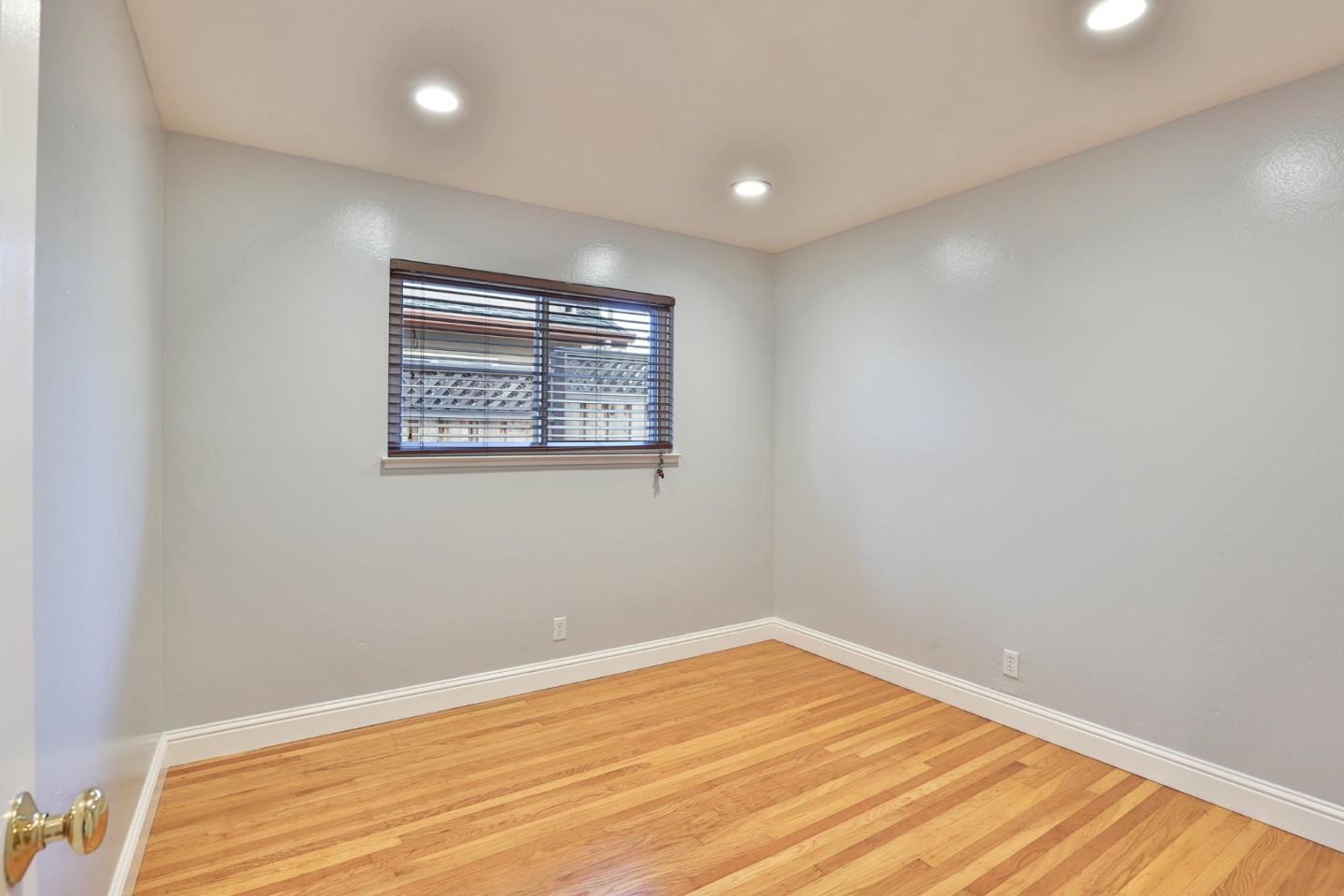 263 Bieber Drive San Jose, CA 95123 - Photo 14 of 26 a view of empty room with wooden floor and fan