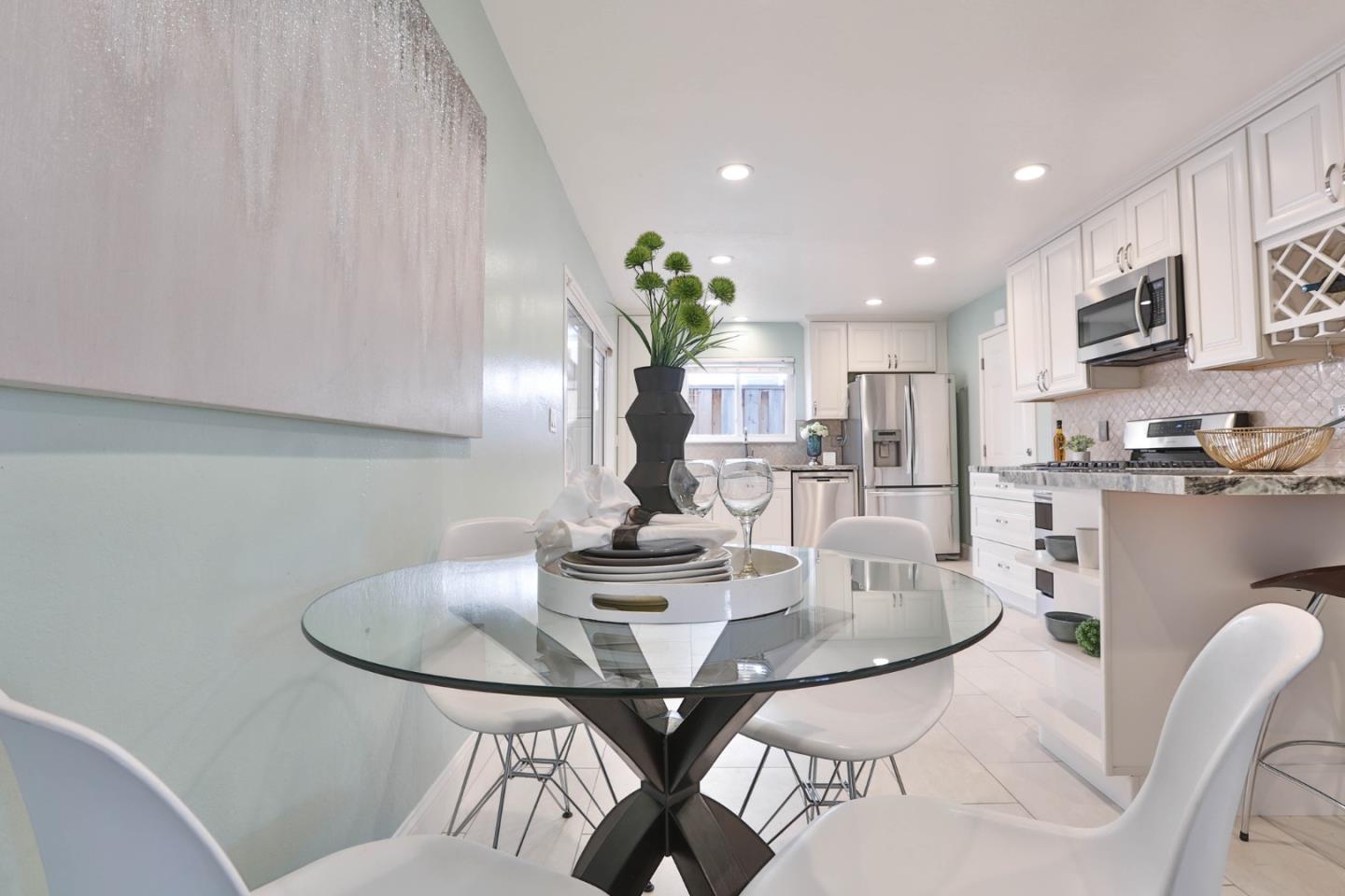 263 Bieber Drive San Jose, CA 95123 - Photo 7 of 26 a kitchen with a table and chairs in it