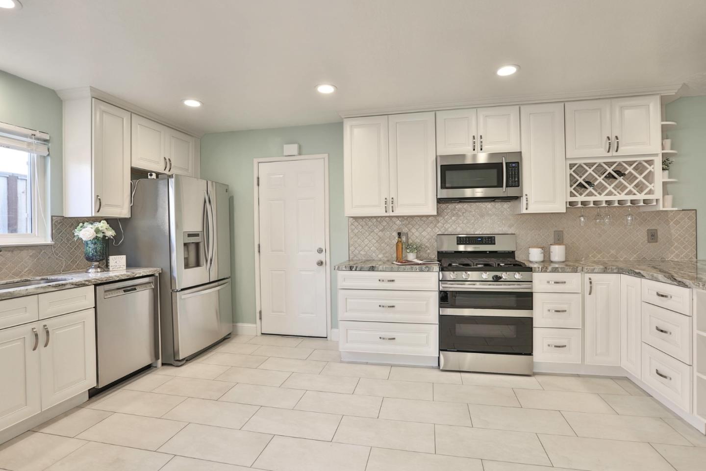 263 Bieber Drive San Jose, CA 95123 - Photo 10 of 26 a kitchen with stainless steel appliances a stove sink and refrigerator