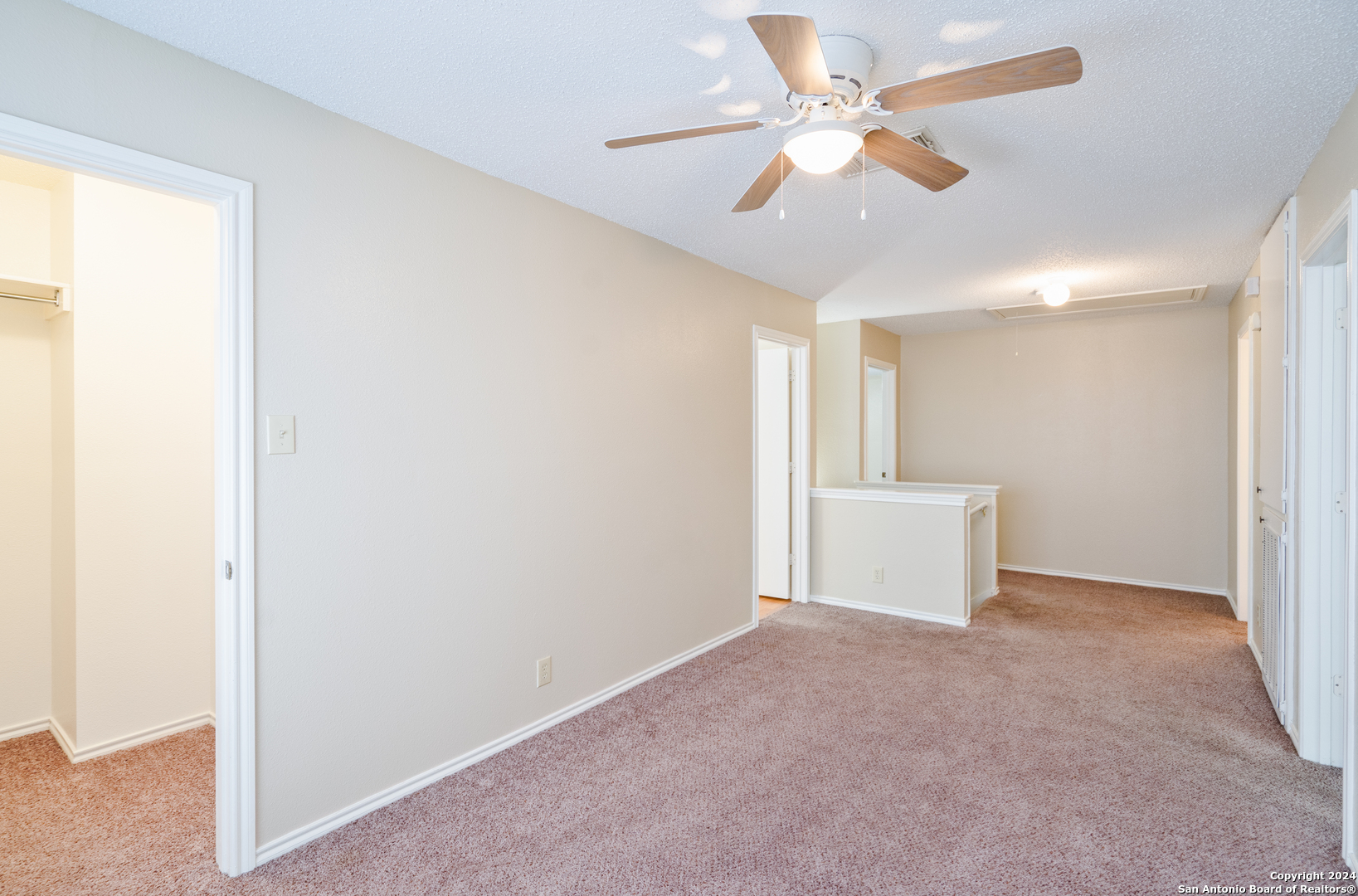 9243 Windward Trace San Antonio, TX 78254 - Photo 16 of 24 a view of an empty room and a ceiling fan