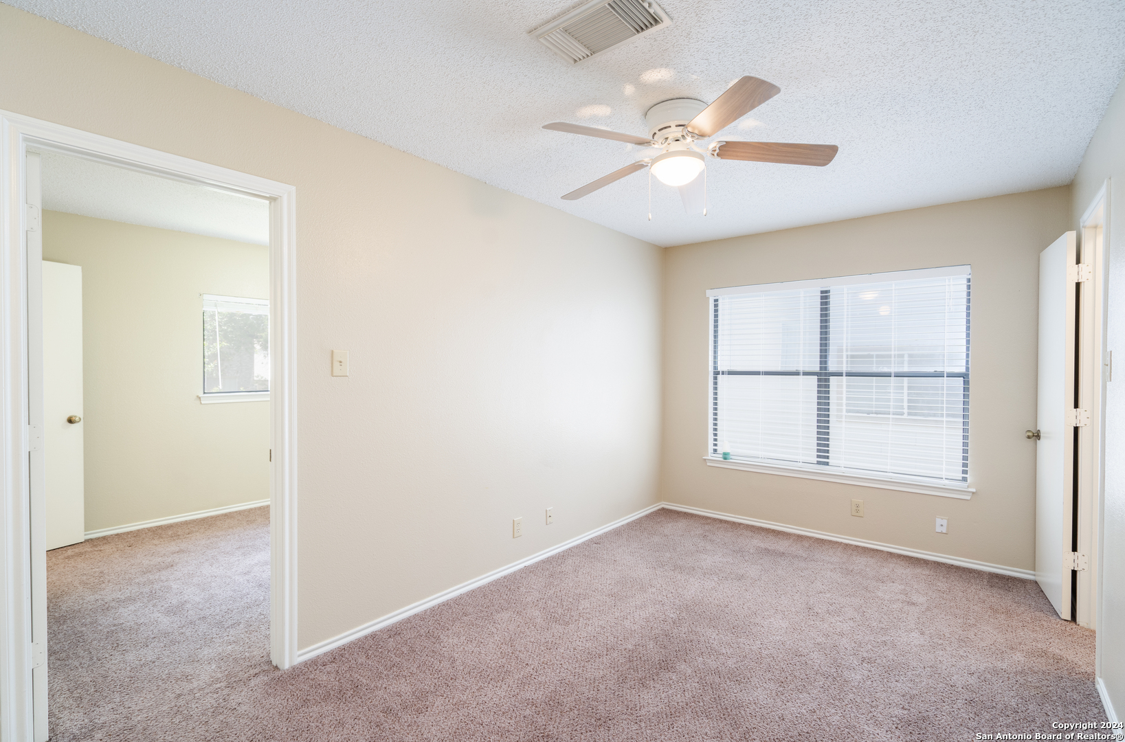 9243 Windward Trace San Antonio, TX 78254 - Photo 17 of 24 a view of an empty room with a window
