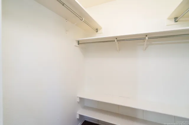 a view of a room with shelf on the wall