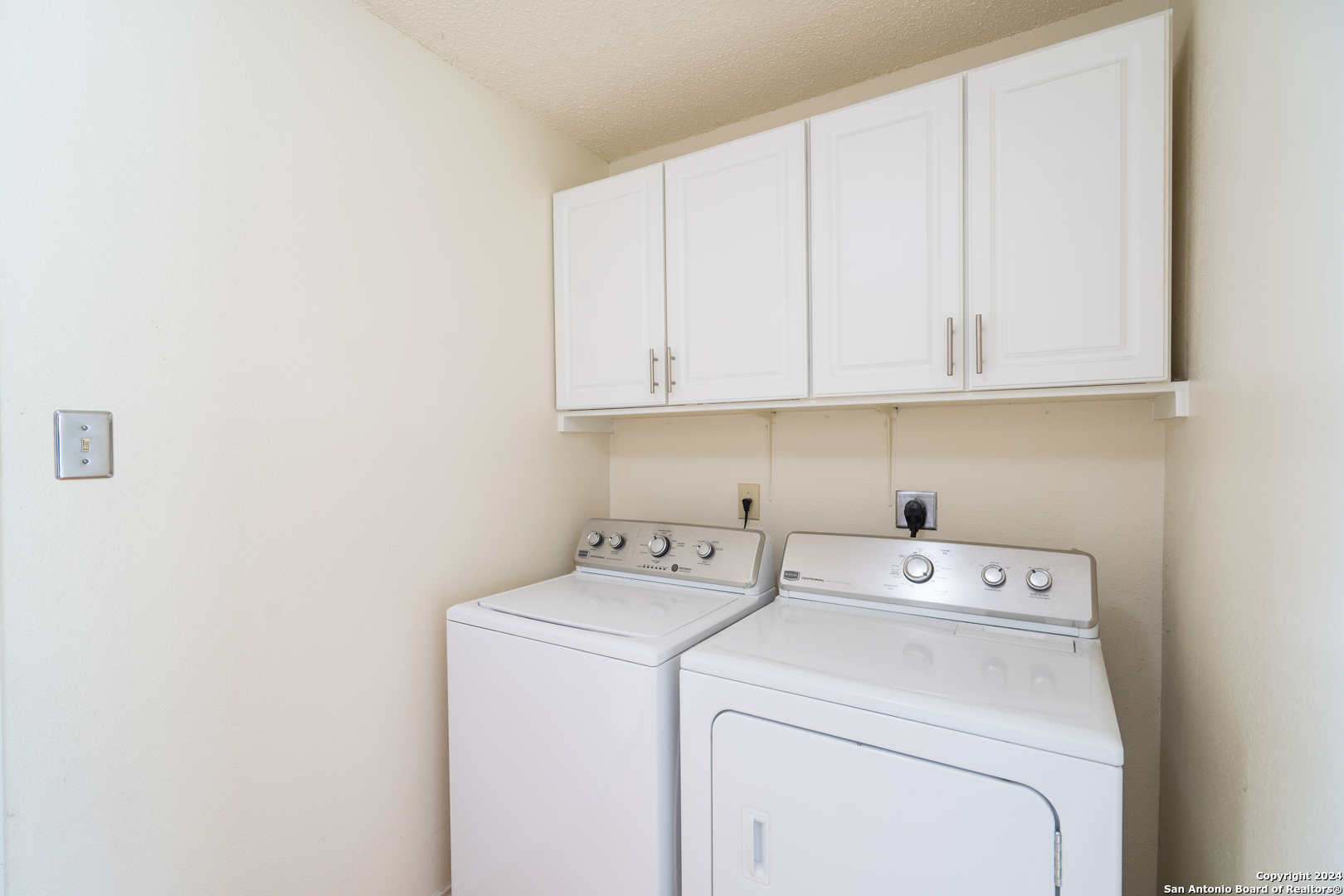 9243 Windward Trace San Antonio, TX 78254 - Photo 22 of 24 a view of storage and utility room with washer and dryer