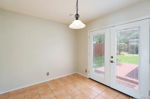 a view of an entryway with wooden floor and door