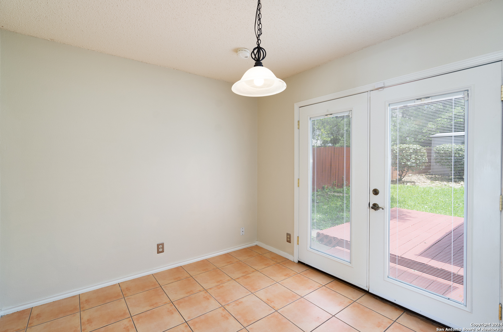 9243 Windward Trace San Antonio, TX 78254 - Photo 23 of 24 a view of an entryway with wooden floor and door