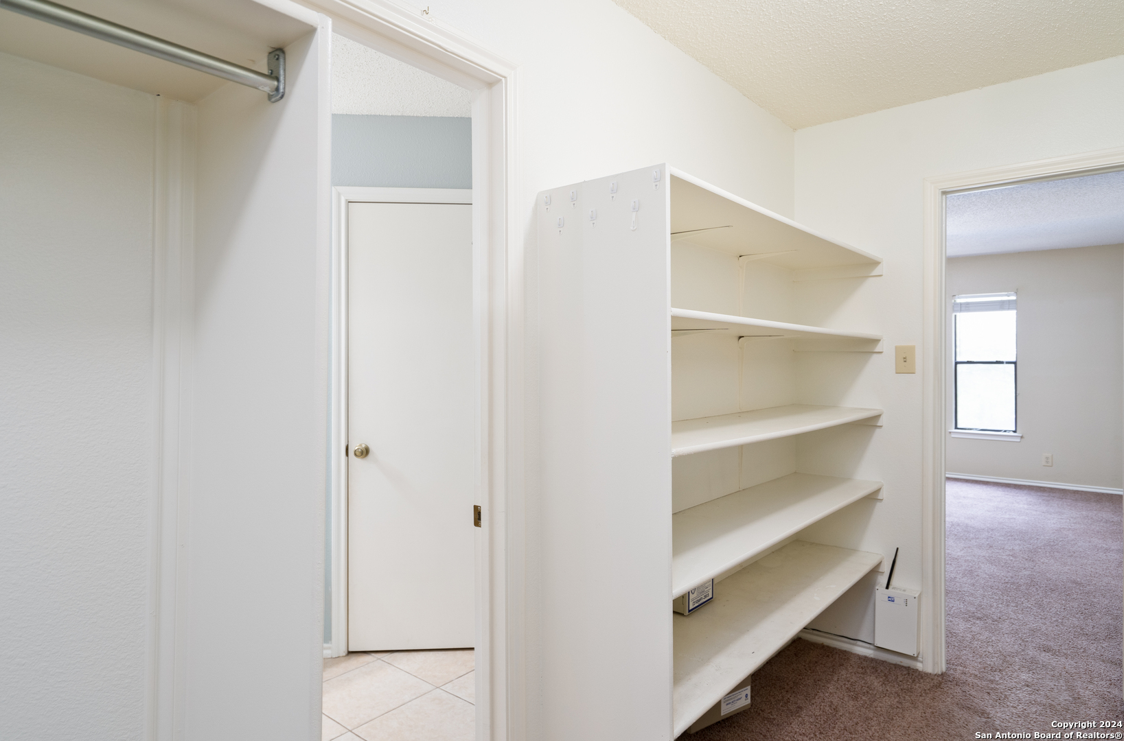 9243 Windward Trace San Antonio, TX 78254 - Photo 5 of 24 a view of an empty walk in closet