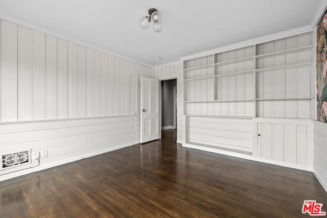 1307 South Rimpau Boulevard Los Angeles, CA 90019 - Photo 12 of 22 a view of an empty room with wooden floor