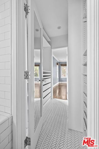 a bathroom with a bathtub and shower