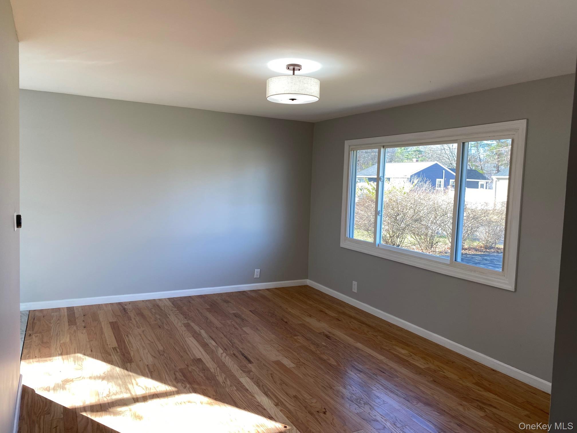 5 Smith Road Cornwall, NY 12518 - Photo 12 of 33 a view of a room with wooden floor and a window
