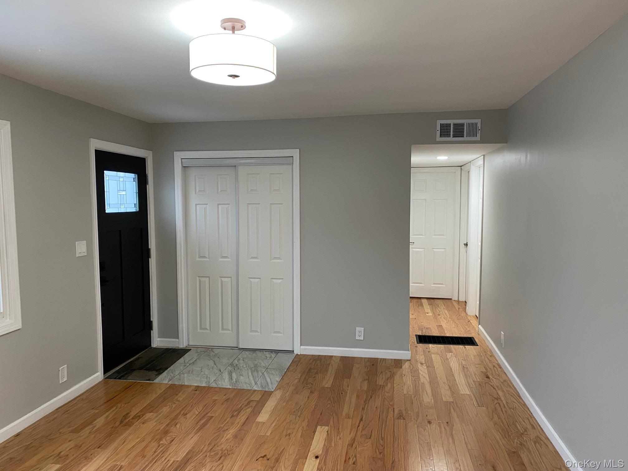 5 Smith Road Cornwall, NY 12518 - Photo 14 of 33 an empty room with wooden floor and a ceiling fan