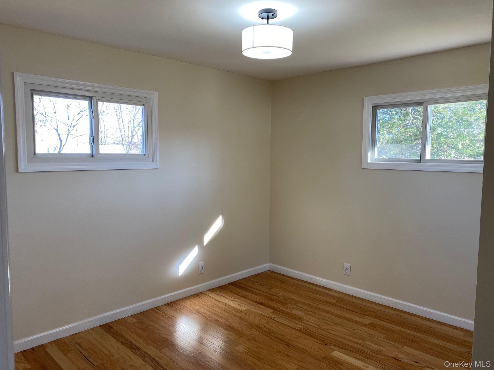 5 Smith Road Cornwall, NY 12518 - Photo 26 of 33 an empty room with wooden floor and windows