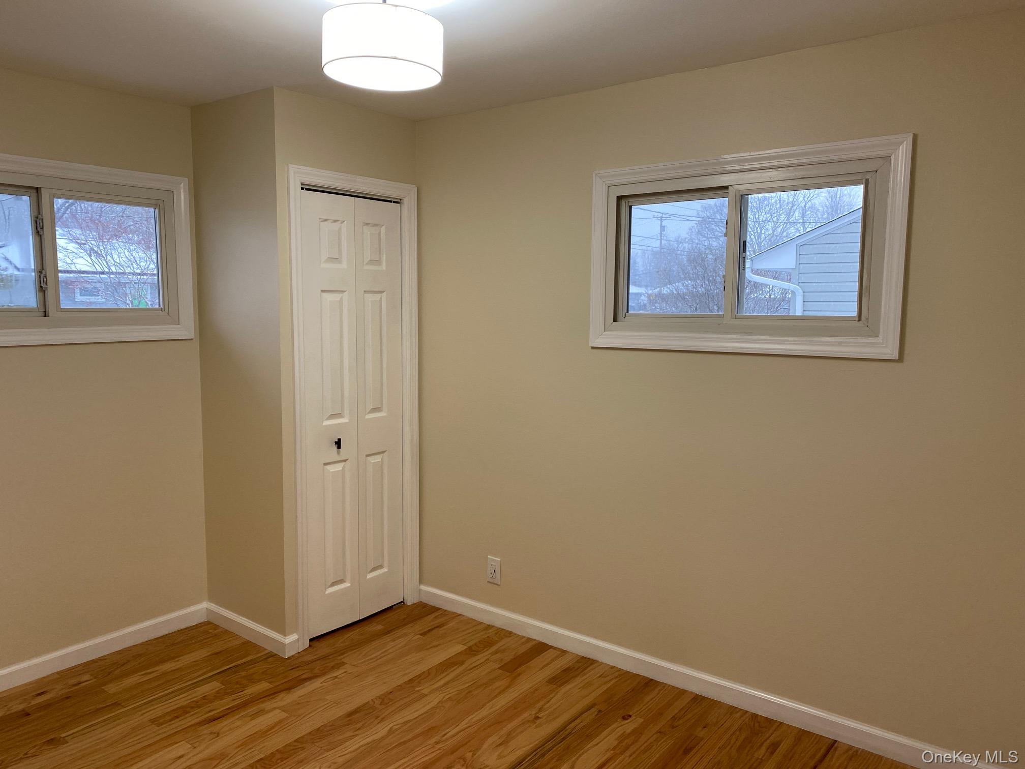 5 Smith Road Cornwall, NY 12518 - Photo 29 of 33 a view of an empty room with wooden floor and a window