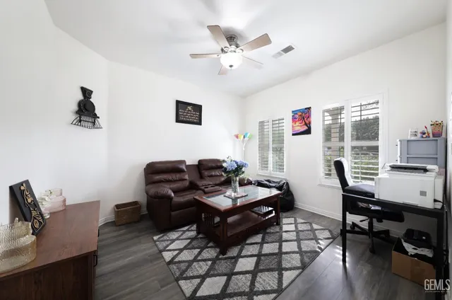a work room with furniture and wooden floor
