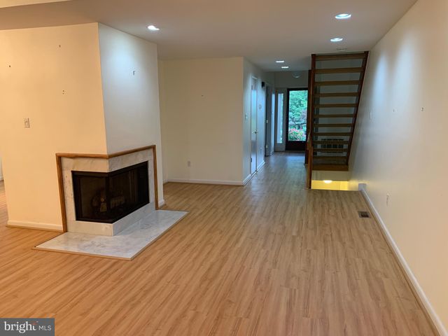 a view of a livingroom with wooden floor