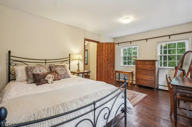 a bed room with a bed and a fireplace