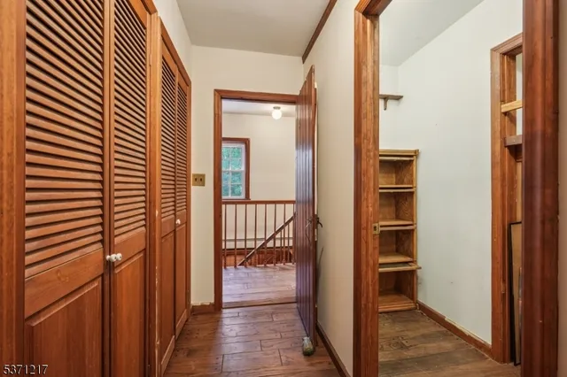 a view of balcony with wooden floor and fence