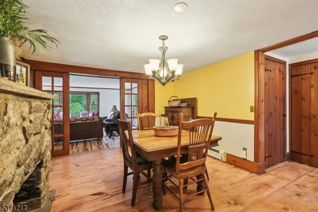 a dining room with furniture and entryway