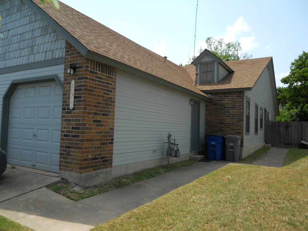 9406 Kempler Drive, Unit A Austin, TX 78748 - Photo 1 of 21 a front view of a house with a yard