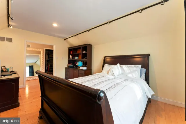 a bed room with a bed and a television