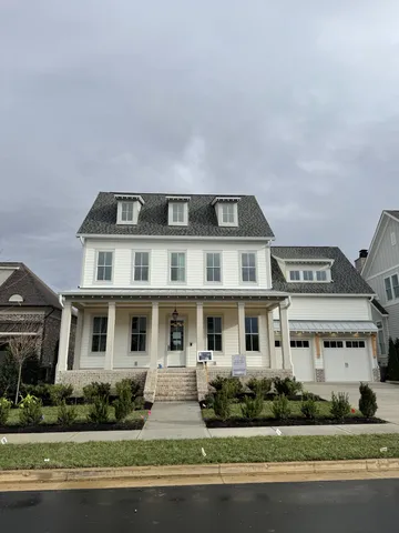 a front view of building with yard