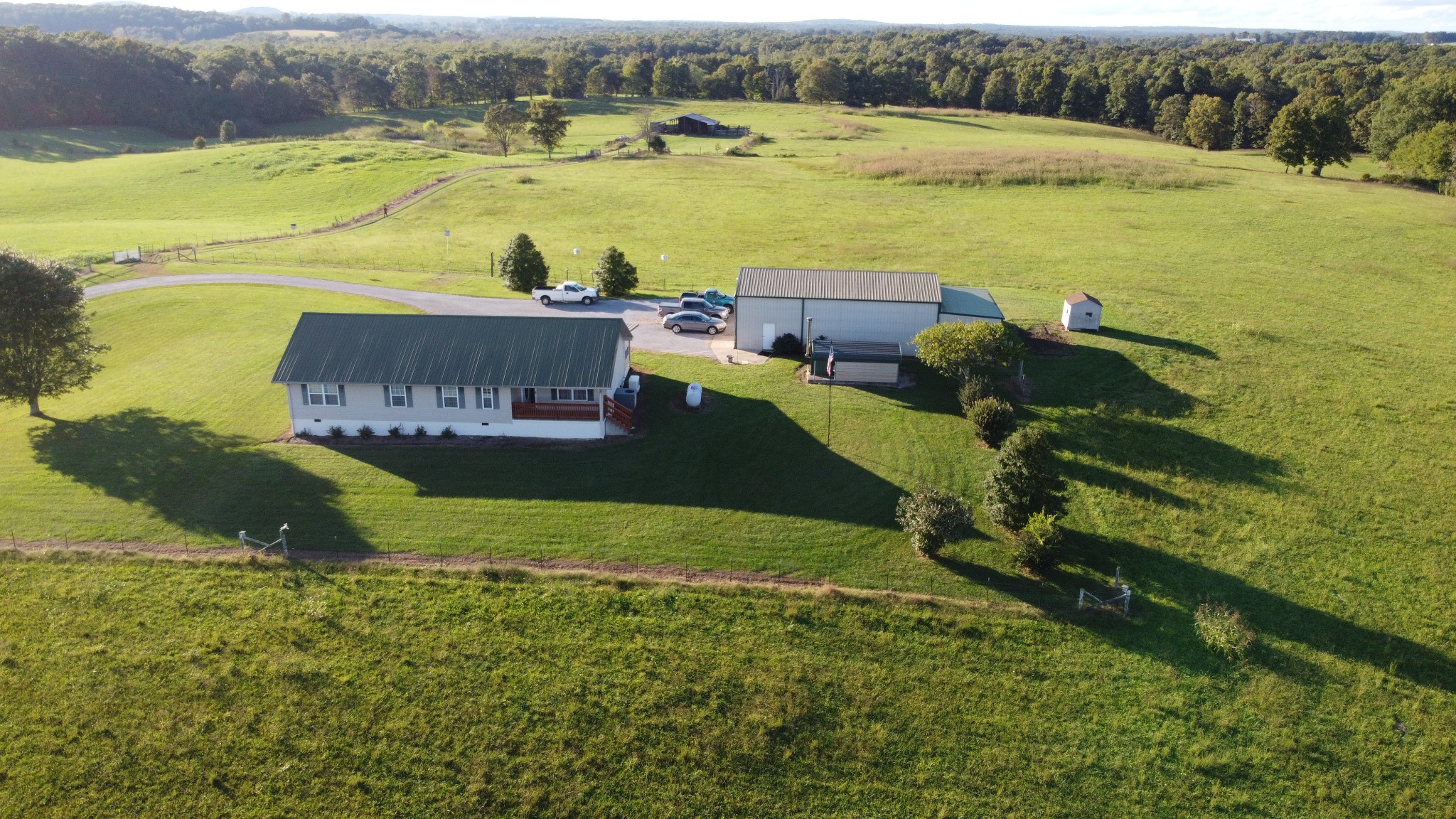 a view of a field with an ocean