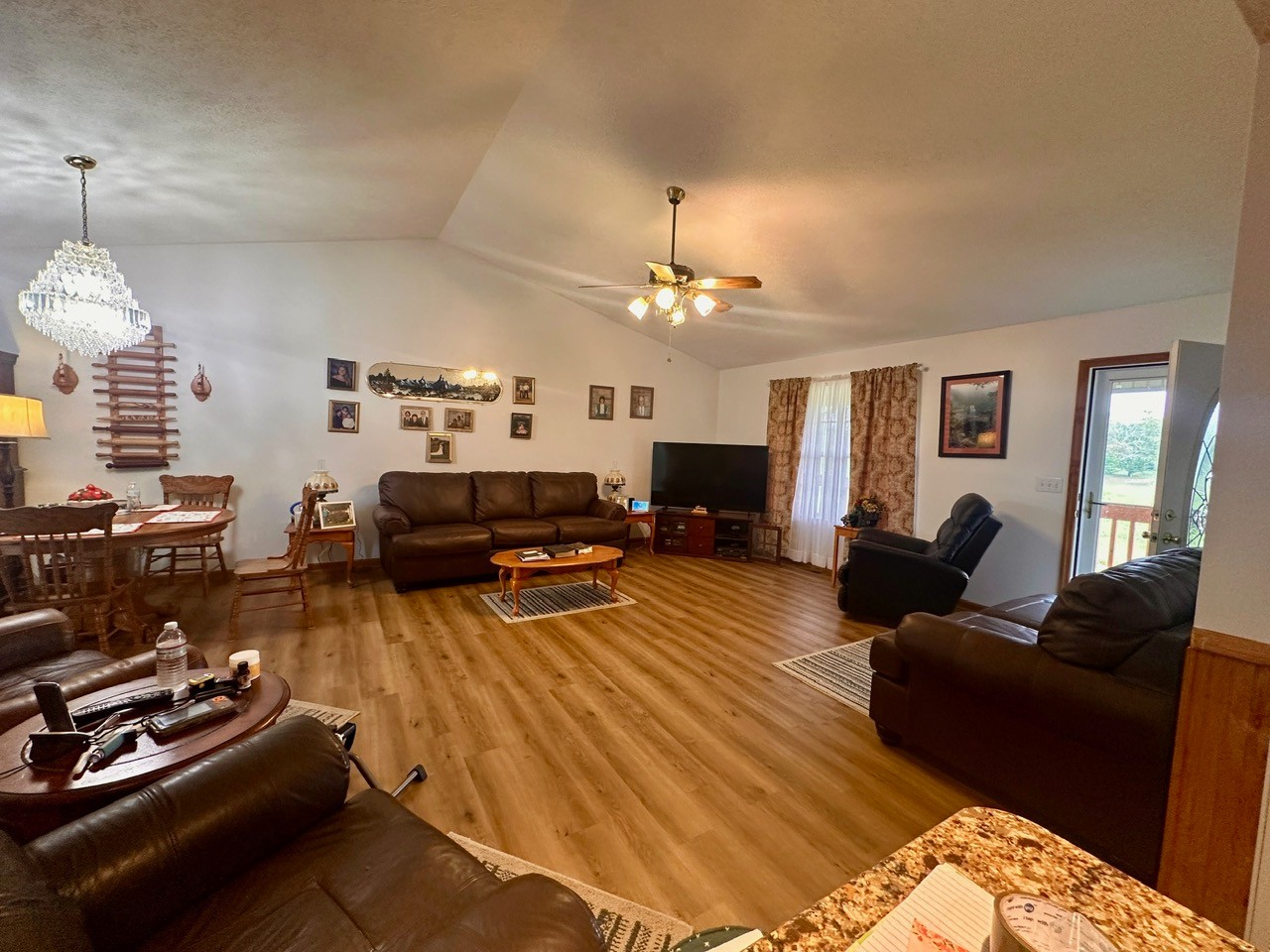 12343 Griffith Road Pikeville, TN 37367 - Photo 23 of 28 a living room with furniture a fireplace and a flat screen tv
