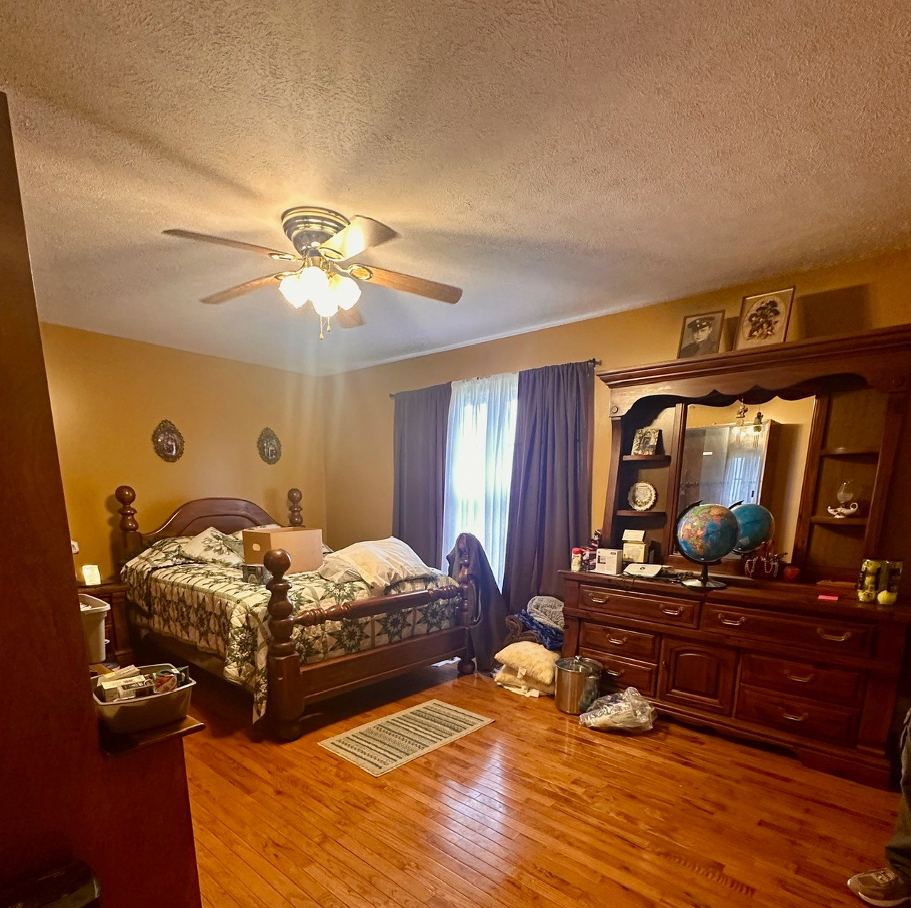 12343 Griffith Road Pikeville, TN 37367 - Photo 26 of 28 a bedroom with a bed and a dresser with mirror