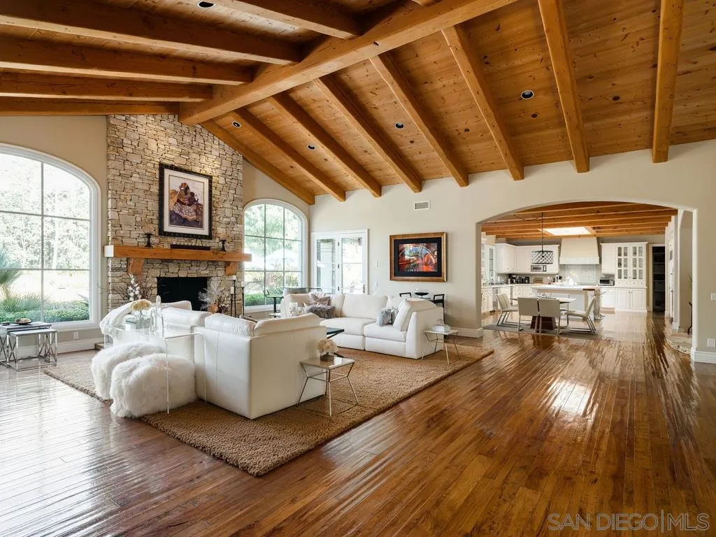 18072 Rancho La Cima Corte Rancho Santa Fe, CA 92067 - Photo 12 of 32 a living room with furniture and a fireplace
