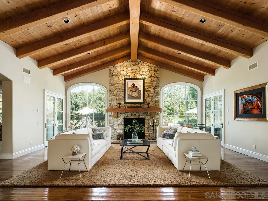 18072 Rancho La Cima Corte Rancho Santa Fe, CA 92067 - Photo 13 of 32 a living room with furniture and a large window
